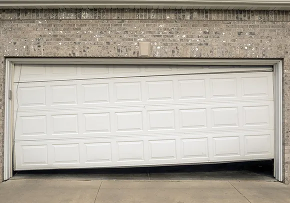 A well-maintained garage door on a brick house in Elk Grove, CA, representing professional garage door function services.